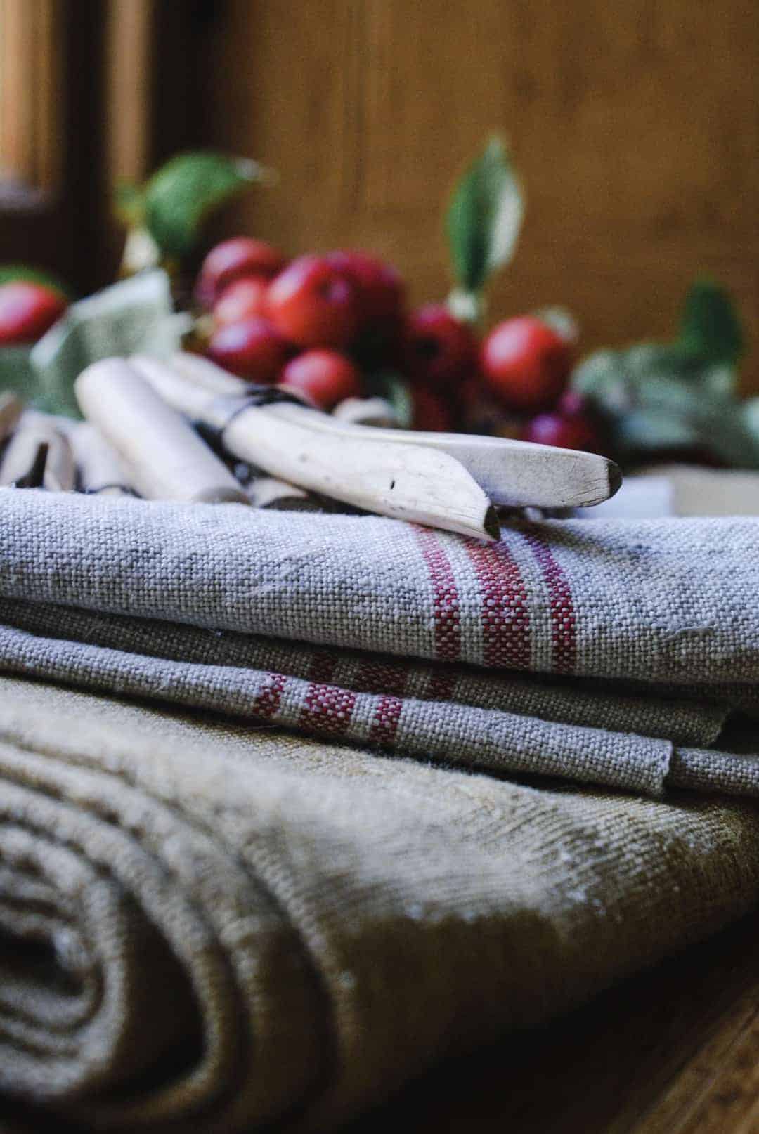 love this vintage red striped linen with crab apples and old wooden pegs at old regency window with linen and wooden clothes pegs at The Regency Townhouse for the launch of Conscious Creativity by Philippa Stanton aka @5ftinf. Click through for a peek inside and a look behind the scenes at the launch workshop 