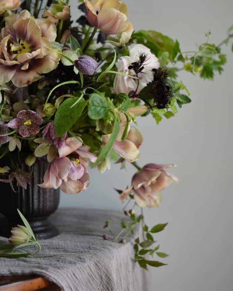 love these blush pink tulips and spring flowers in deep purples with lime green herbs and foliage grown by Simply by Arrangement - sustainable british flowers and flower designs from Yorkshire. Click through to see more of Simply by Arrangement founder, Sarah Statham's inspirations, simple pleasures and local loves as well as more stunningly beautiful british flower arrangements you'll love