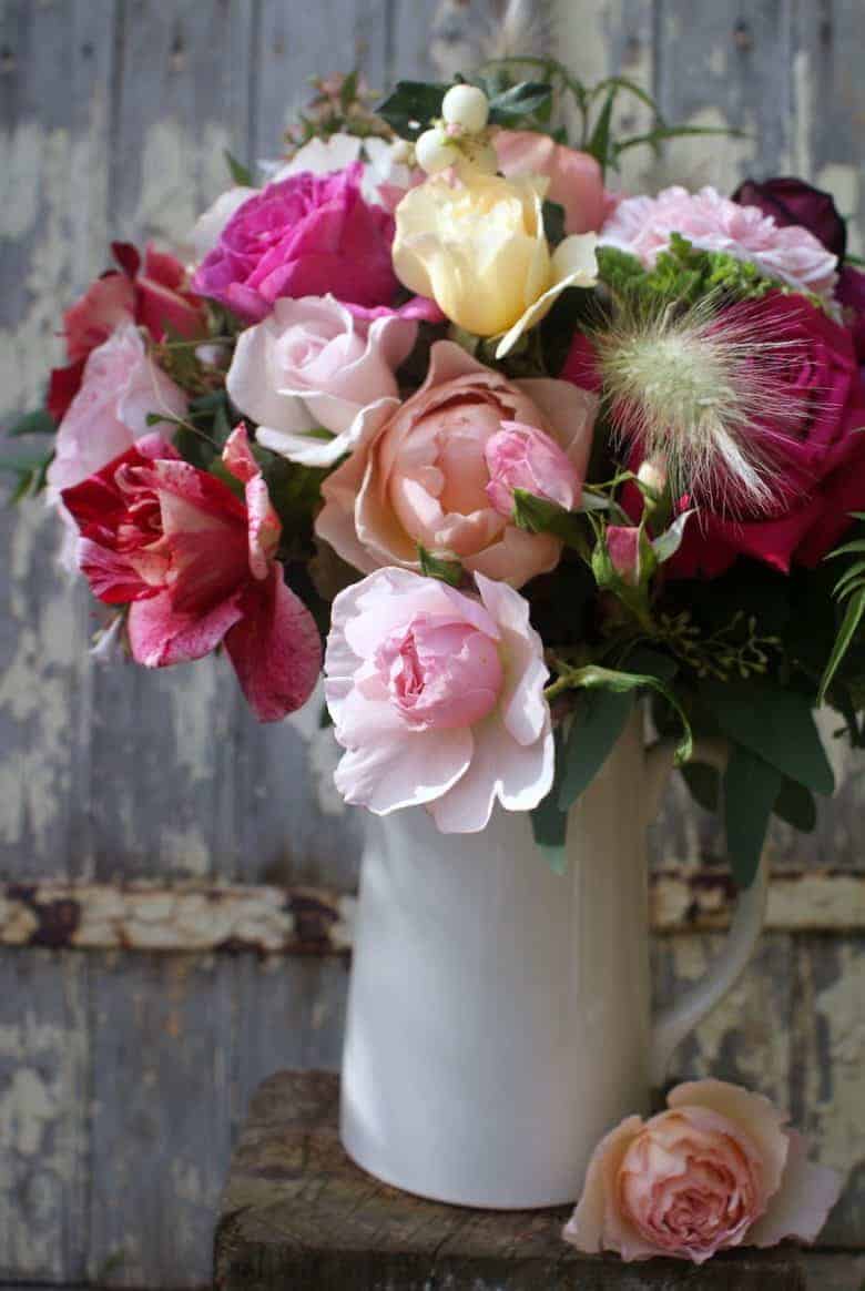 how to start a cutting garden flower growing for cut flowers - expert tips and ideas to help you create your own flower cutting patch and pick the most beautiful sustainable flowers all year round like these deep old fashioned scented english roses. Click through to get all you need to know from green & gorgeous, the real flower company, floret flower farm and more #cuttinggarden #britishflowers #flowers #roses #scented #growing #sustainable #frombritainwithlove #sweetpeas