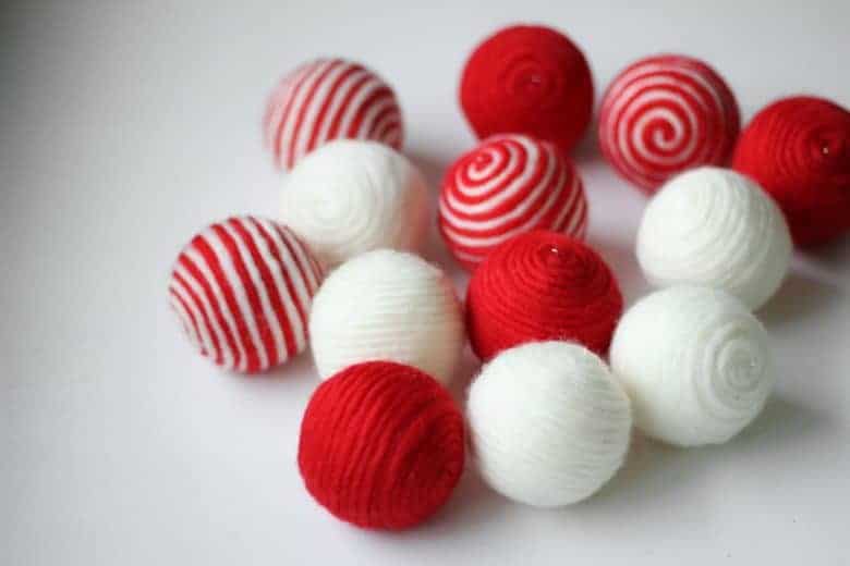 how to make stripy wool baubles. Click through for easy step by step tutorial to making these simple to make beautiful christmas decorations to love for years and years