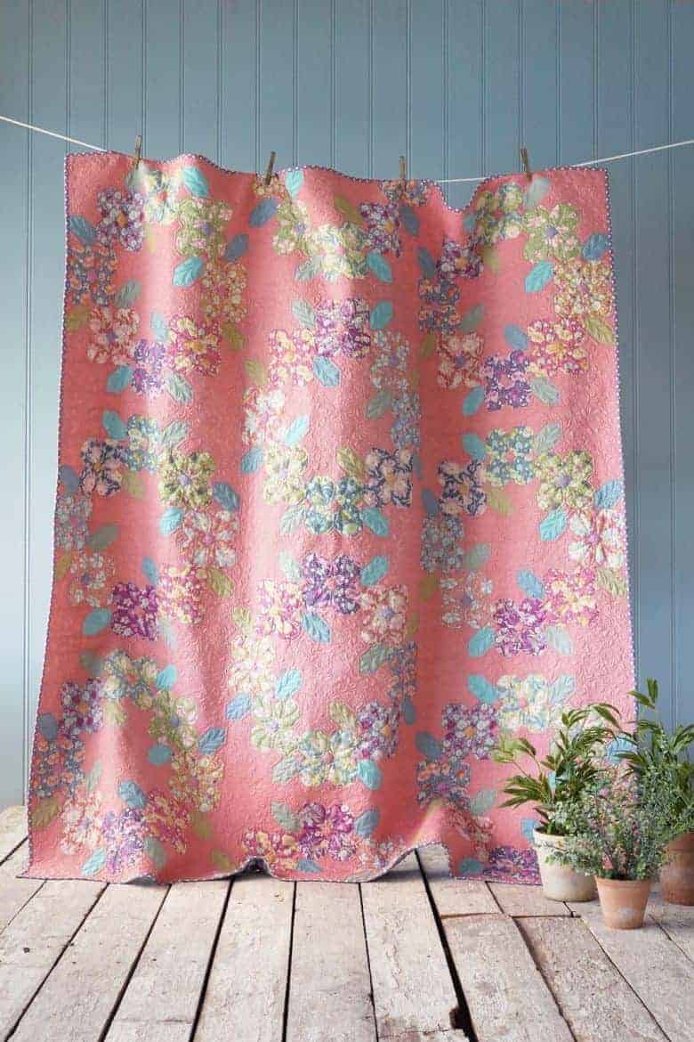 free patchwork quilt pattern Flower Wreath in Coral pinkfrom Tilda - get your free pattern download as well as all the links you need to source pretty fabric from the Gardenlife collection and beyond #patchwork #quilt #pattern #free