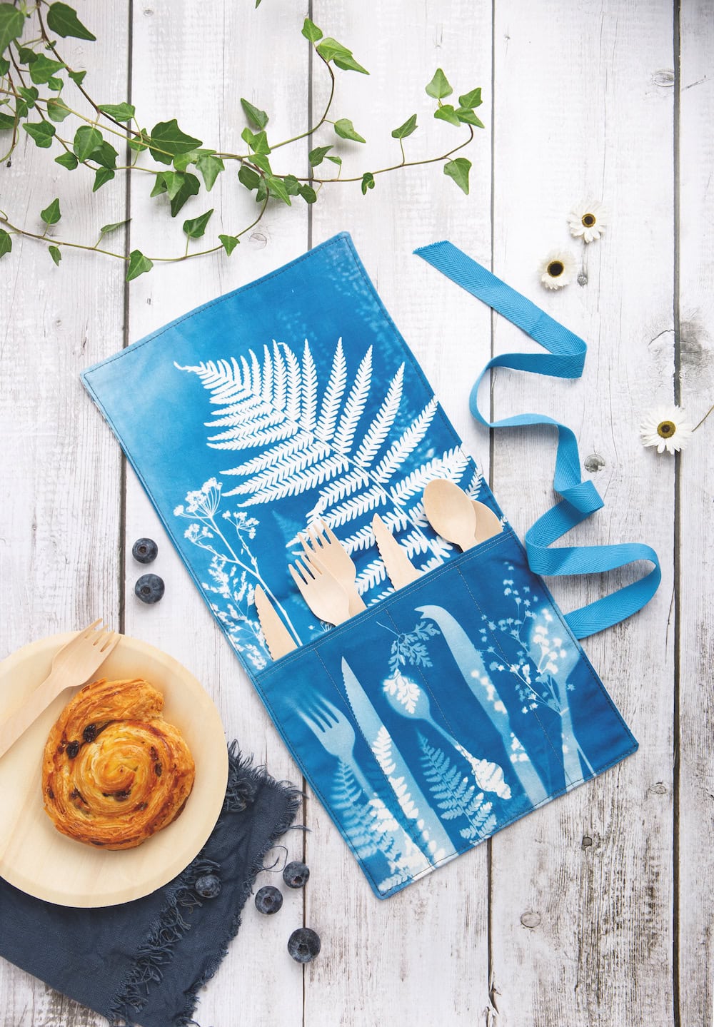 cyanotype cutlery roll with fern design by kim tillyer from her new book Beginner's Guide to Cyanotype. We have four signed copies to give away as well as a free diy tutorial by kim for you to try your hand at this highly enjoyable and creative craft