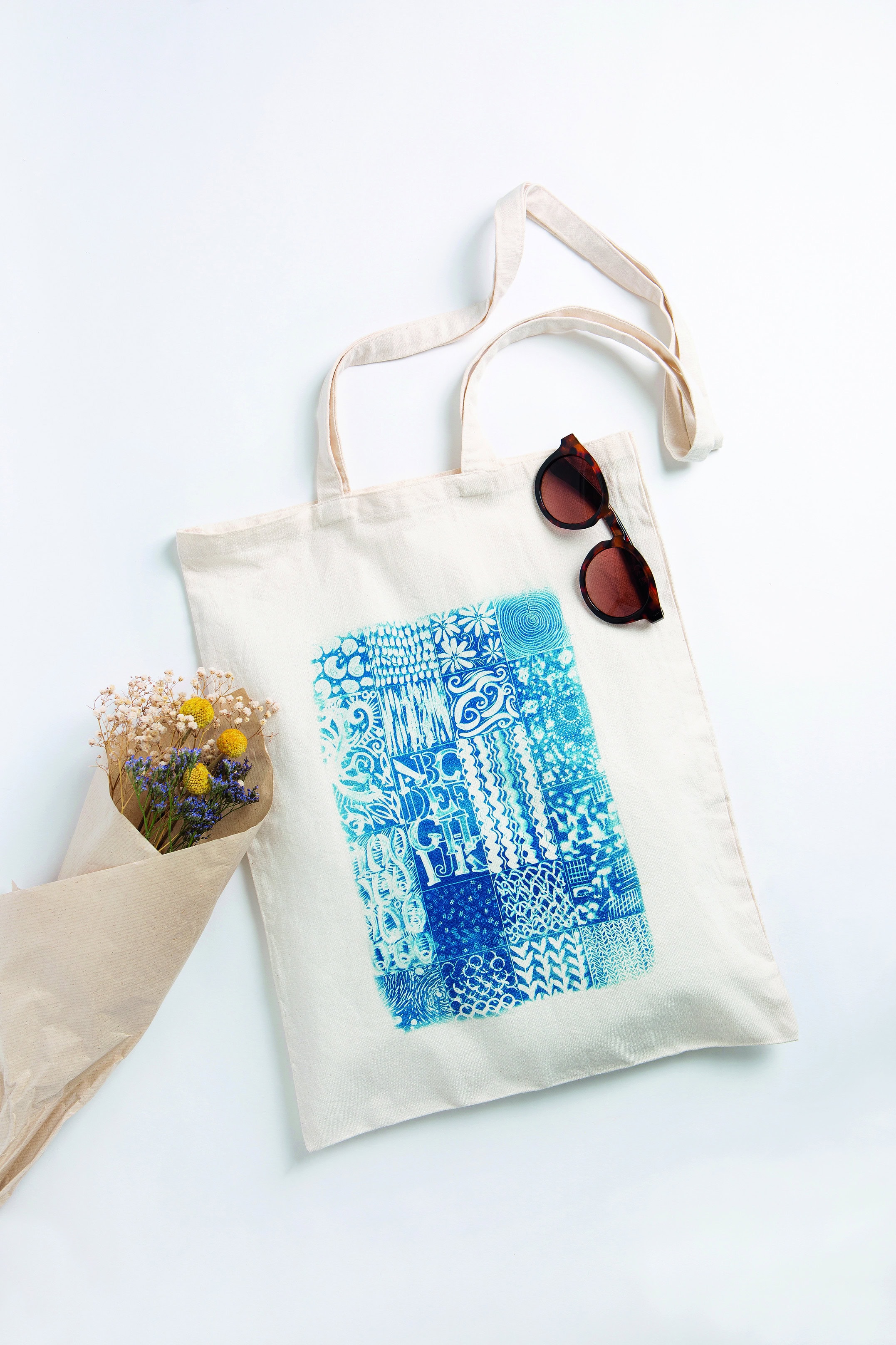 cyanotype tote bag design by kim tillyer from her new book Beginner's Guide to Cyanotype. We have four signed copies to give away as well as a free diy tutorial by kim for you to try your hand at this highly enjoyable and creative craft