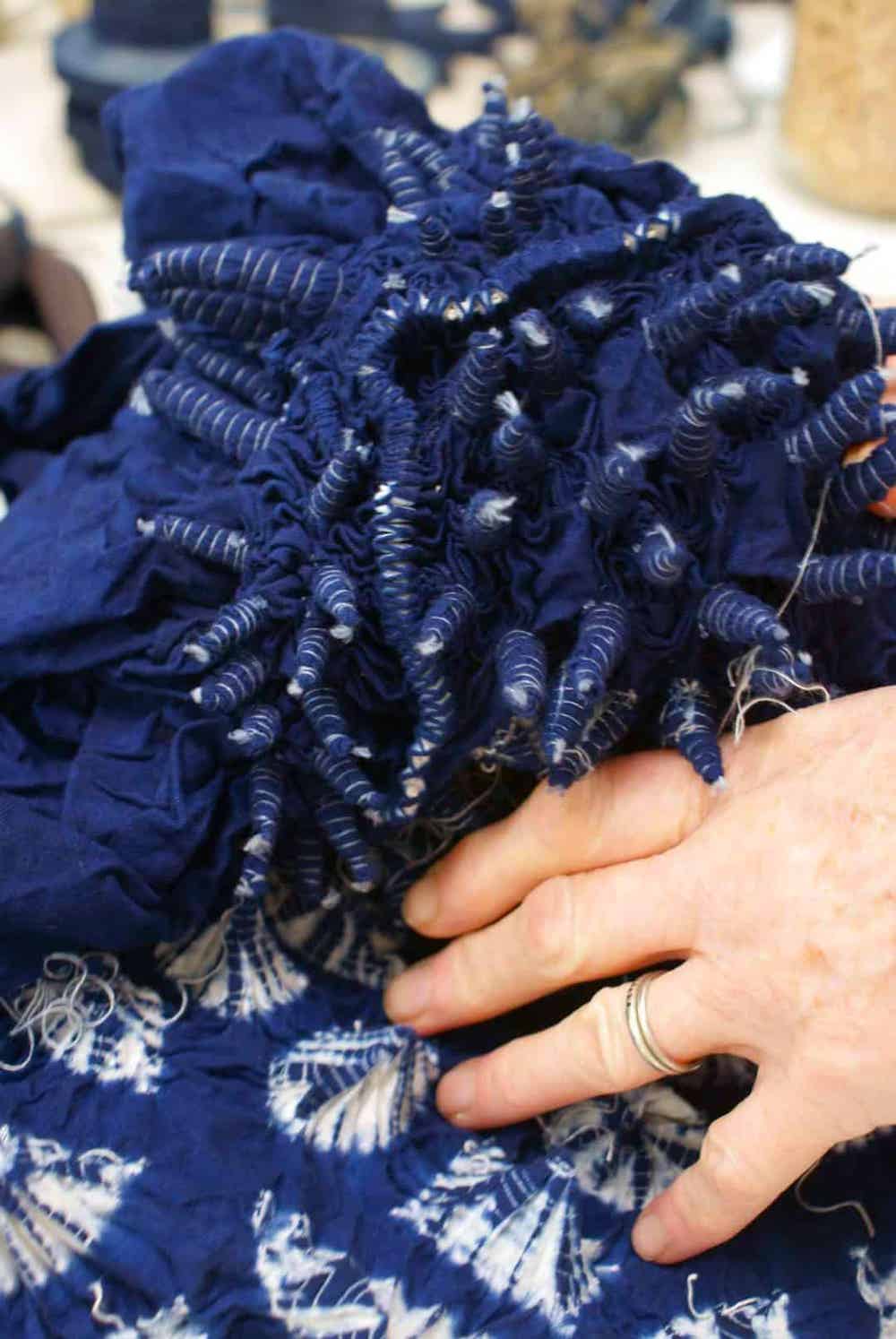 shibori indigo tie dye technique hand tied sections of fabric