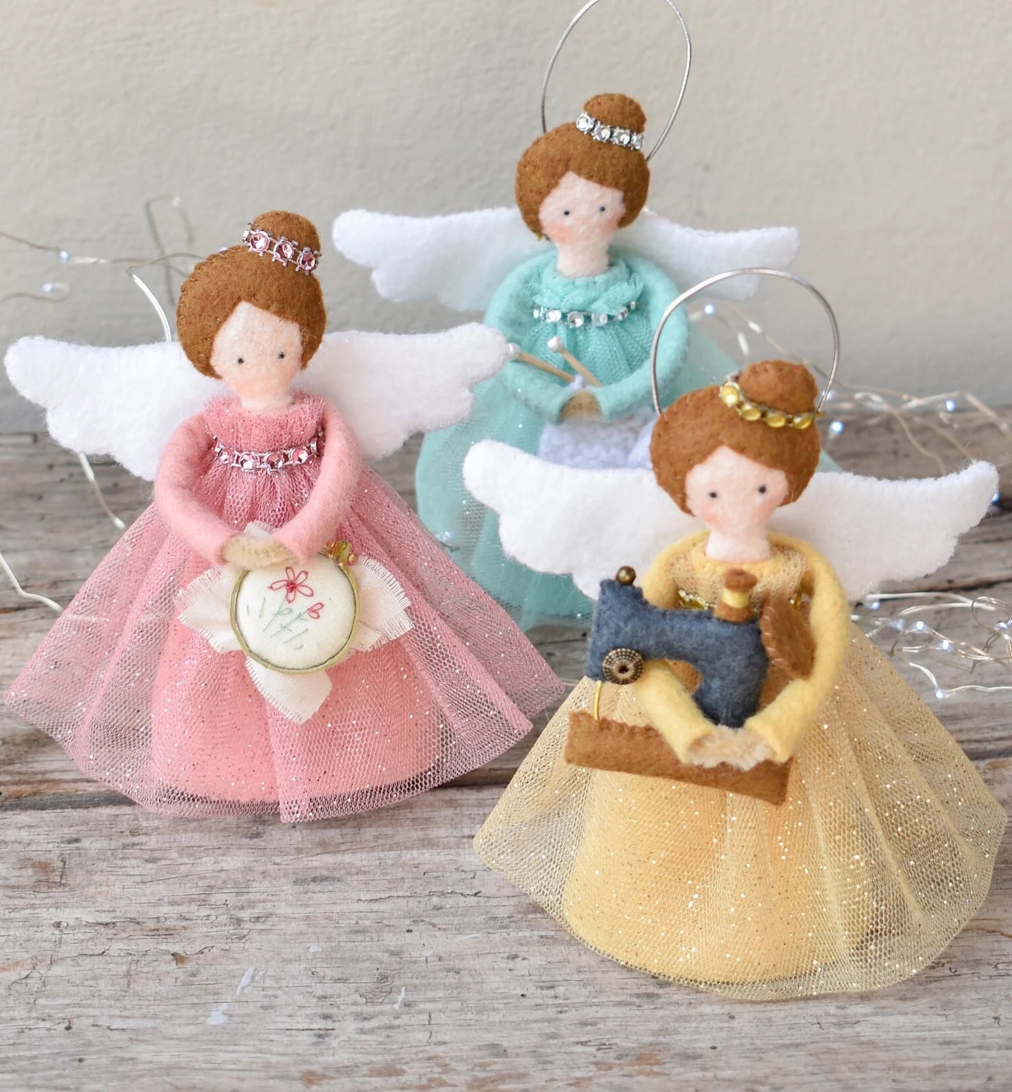 craft angels christmas tree decorations sewing pattern - one with sewing machine, one with embroidery hoop and one with knitting. The kit contains everything you need to make all three. Just lovely