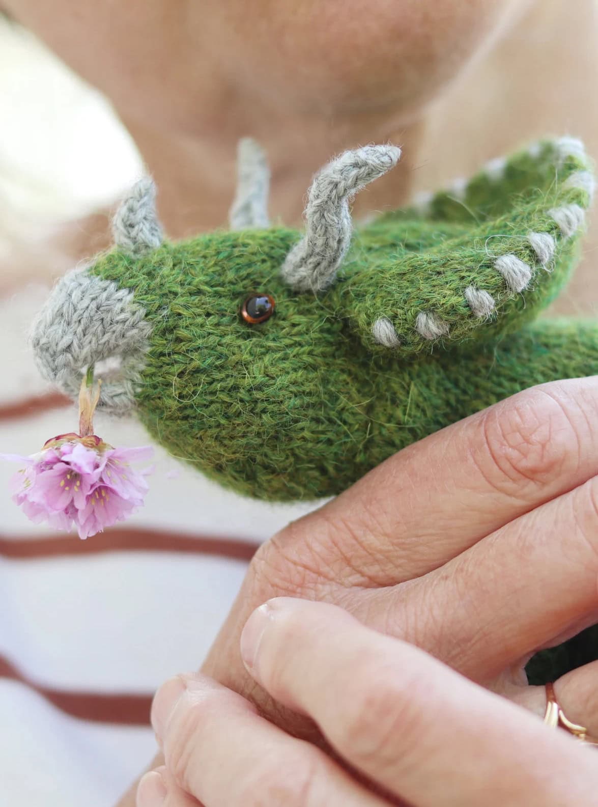 triceratops dinosaur knitting pattern by claire garland aka dot pebbles knits - so adorable and easy to knit for any dino lover in your life. Read my post to get all the info you need to get making this cuddly prehistoric toy today!