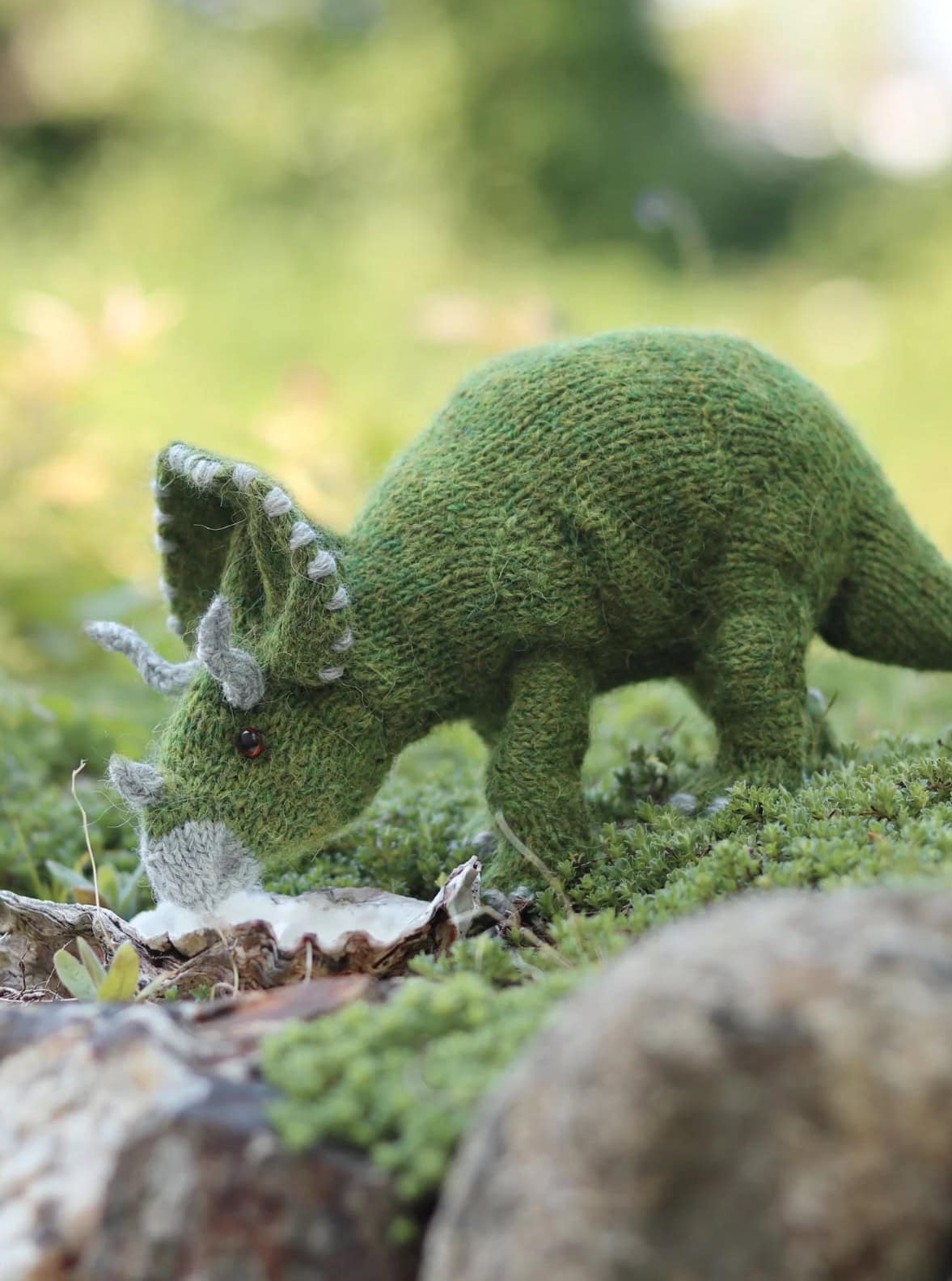 triceratops dinosaur knitting pattern by claire garland aka dot pebbles knits - so adorable and easy to knit for any dino lover in your life. Read my post to get all the info you need to get making this cuddly prehistoric toy today!