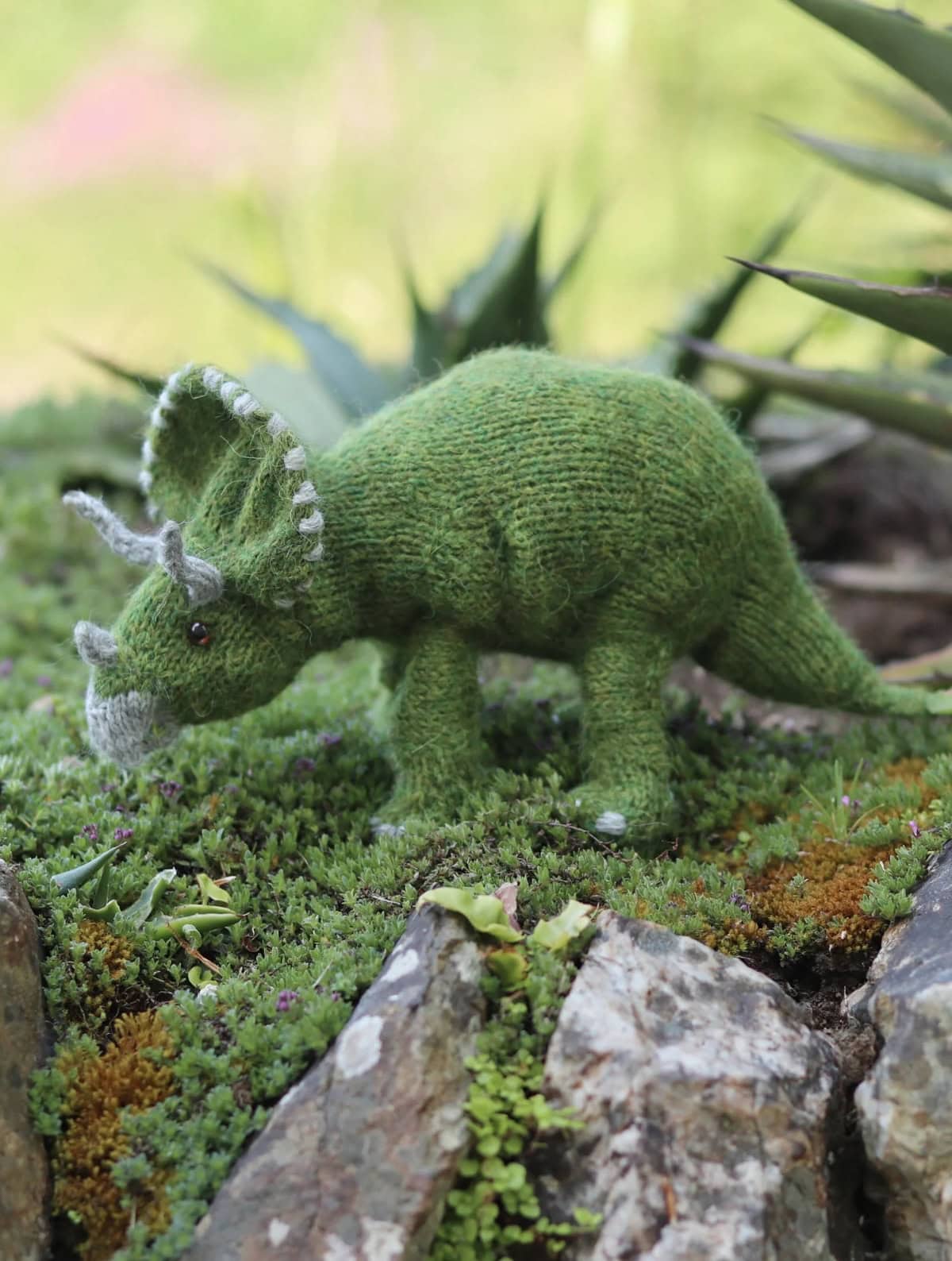 triceratops dinosaur knitting pattern by claire garland aka dot pebbles knits - so adorable and easy to knit for any dino lover in your life. Read my post to get all the info you need to get making this cuddly prehistoric toy today!