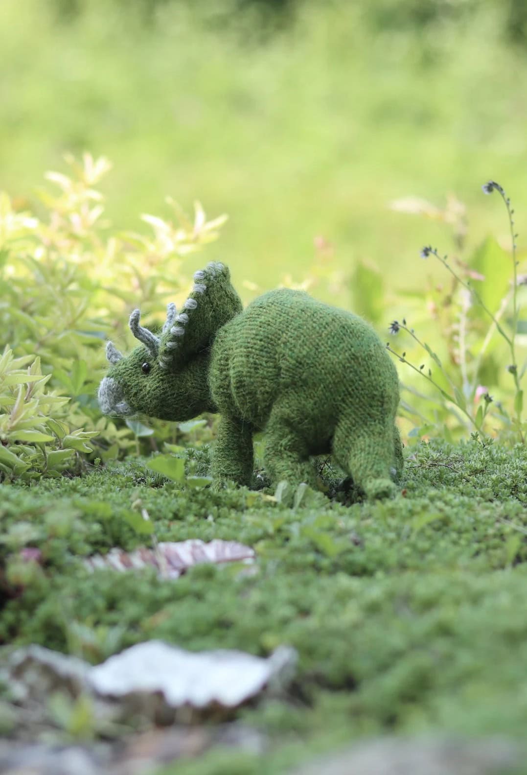 triceratops dinosaur knitting pattern by claire garland aka dot pebbles knits - so adorable and easy to knit for any dino lover in your life. Read my post to get all the info you need to get making this cuddly prehistoric toy today!